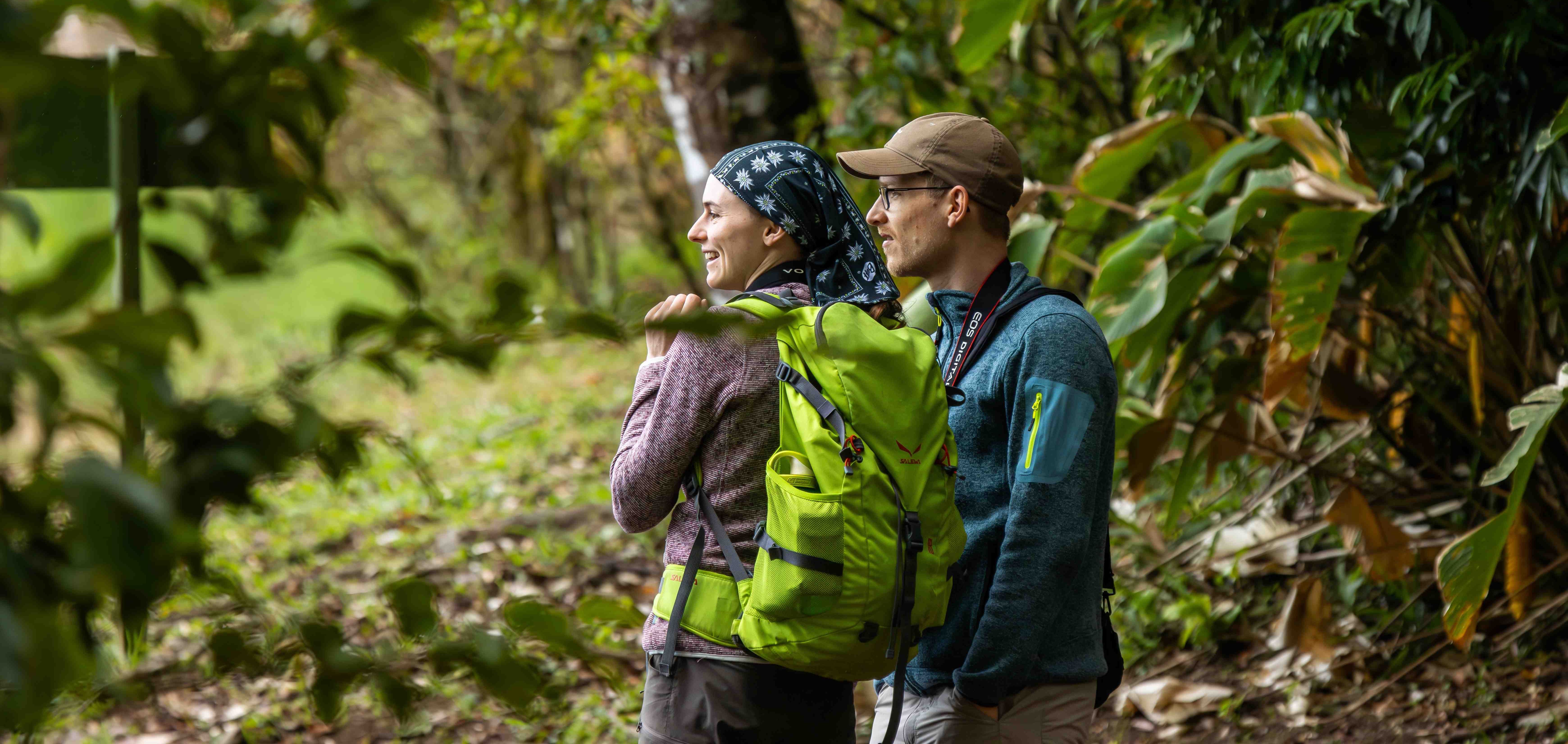 A couple hiking through Monteverde's vibrant forest.