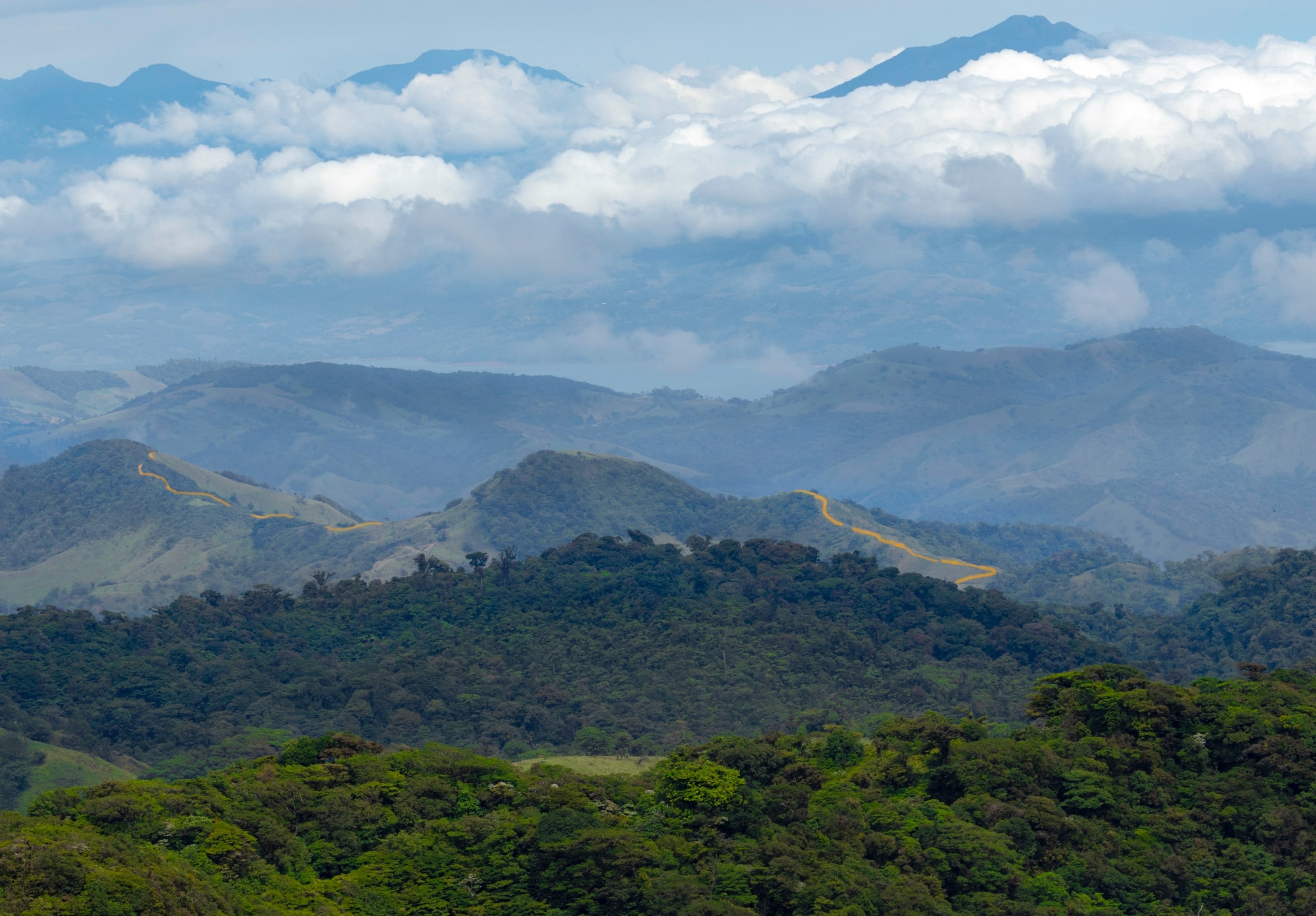 Panoramic view of Monteverde’s mountains with low-lying clouds covering the landscape.